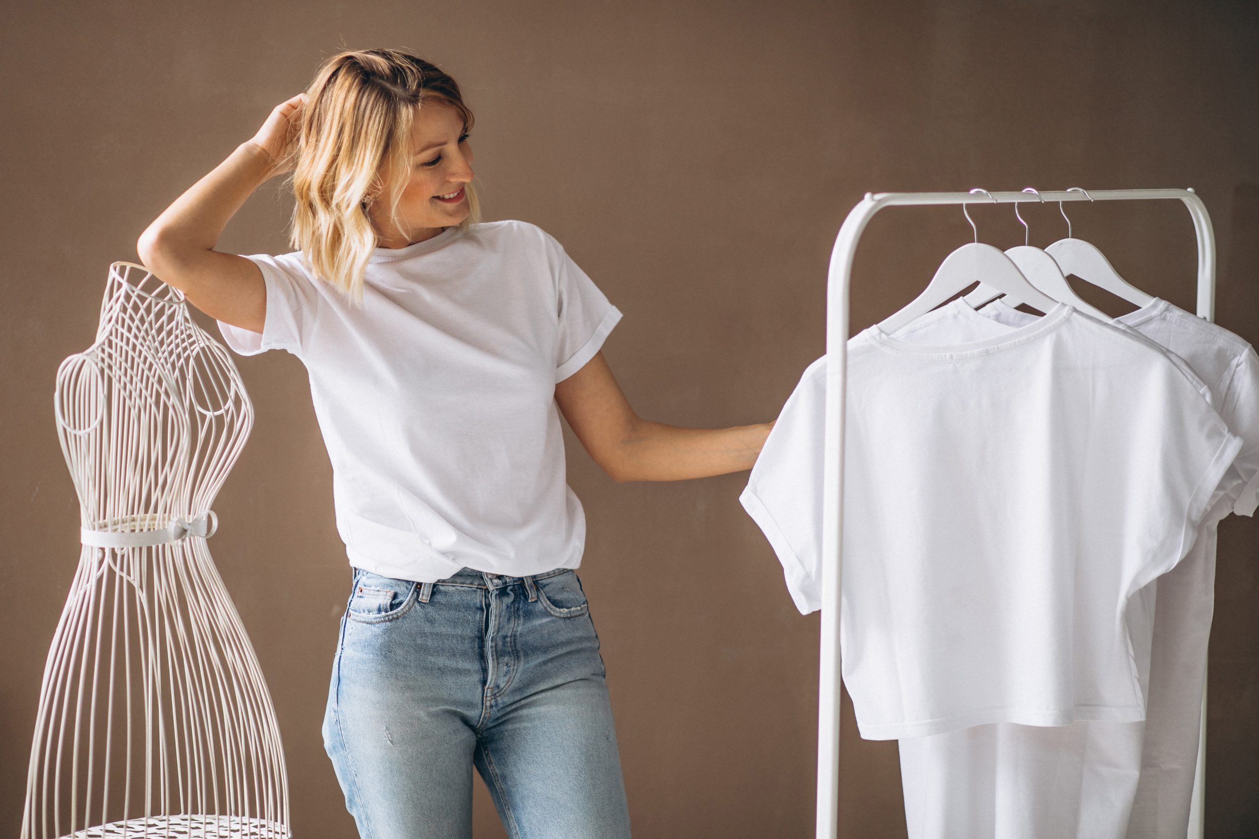 Woman chosing a white shirt | nfrmt